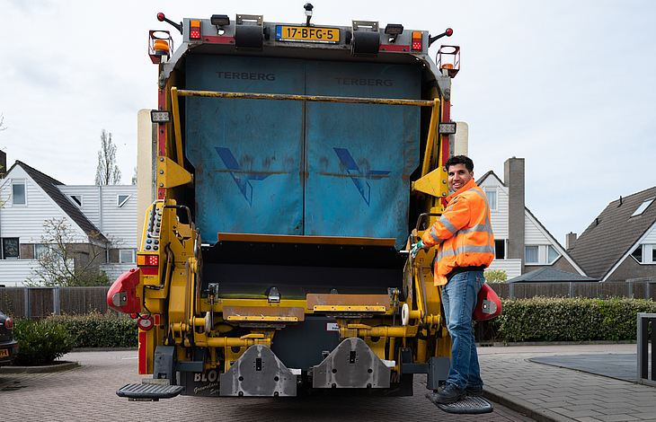 Vuilnisman op vuilniswagen